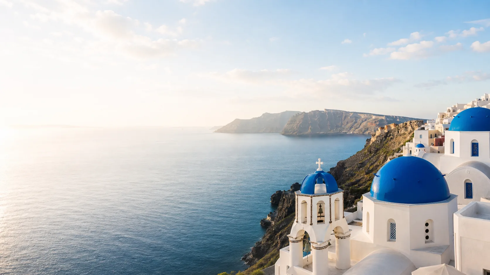 A refined destination view with blue water and architecture
